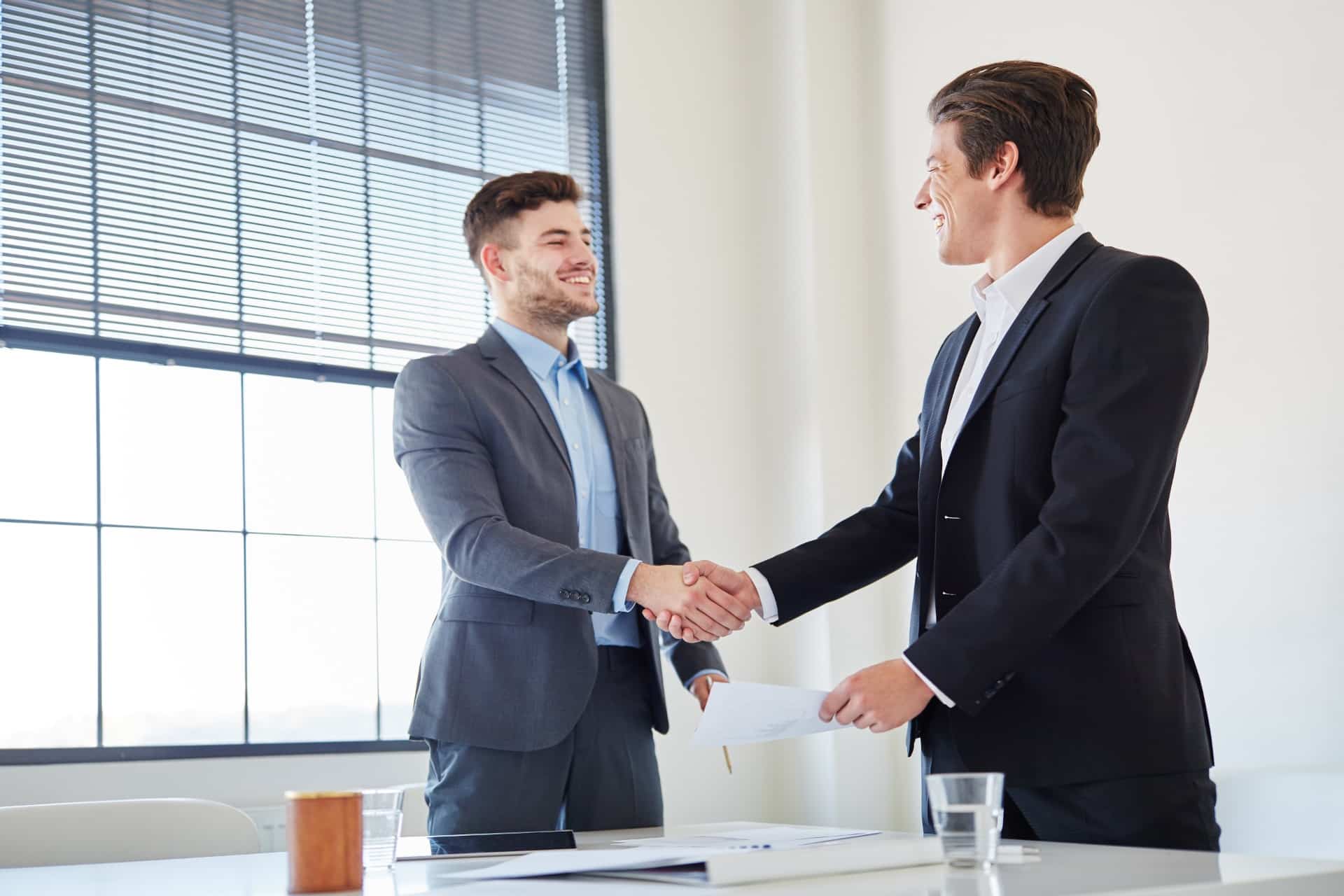 Two Men shaking hands after a Business Meeting